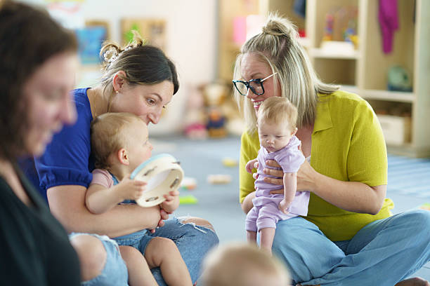 istock Mothers and Babies Enjoy Bonding During a Playful Group Activity 2222638450