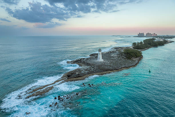 Exposure done at sunset of the Nassau Harbour Lighthouse near Colonial Beach, built in 1847, with the awesome turquoise blue waters surrounding the beautiful island of the Bahamas