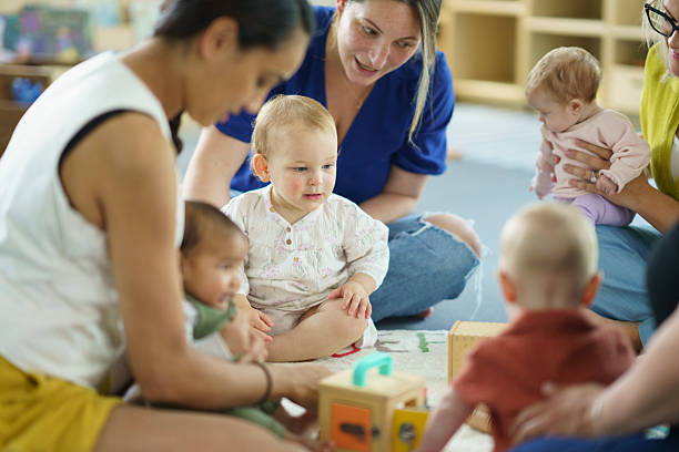 istock Parents and Infants Engaging in a Group Activity in a Childcare Environment 2222638846
