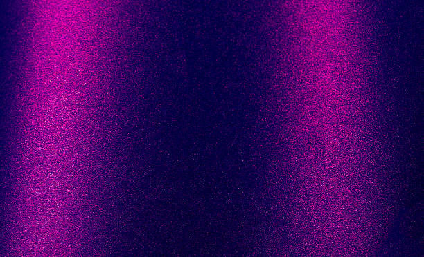 istock Abstract background with gradient noise and grain effect. Black paper texture with glossy violet, 2222639263