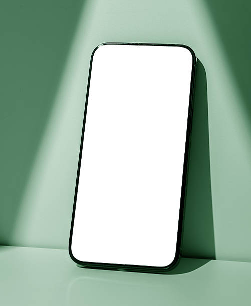 istock Phone screen mockup. Modern black smartphone with glowing touch screen, pastel green background, 2222639266