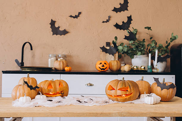 istock Halloween pumpkins and decorations illuminating a cozy kitchen table 2222641489