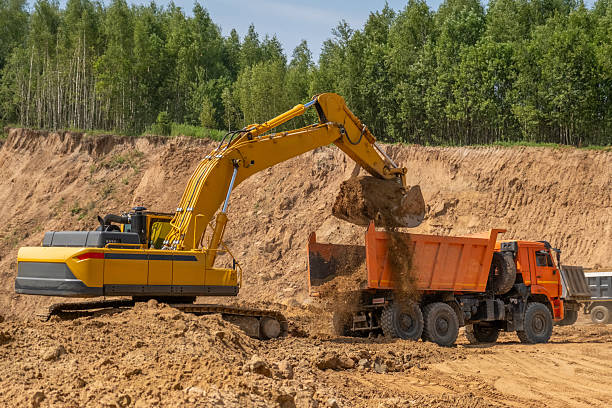 istock The process of loading sand in a sand quarry. Trucks are waiting for cargo. 2222642472