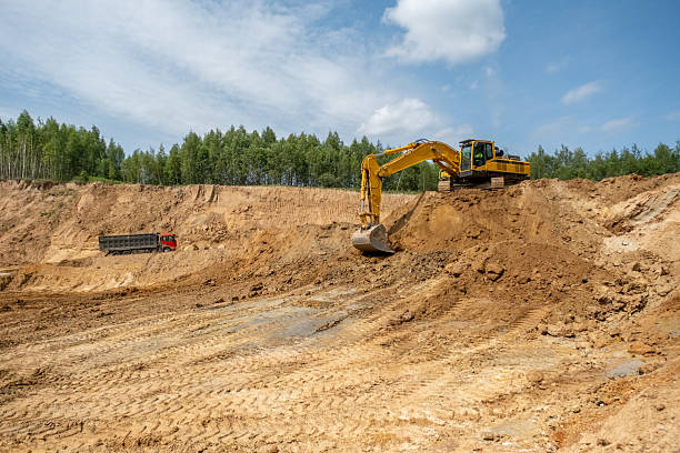 istock A caterpillar tractor works with a bucket in a sand pit. Sand mining 2222642717