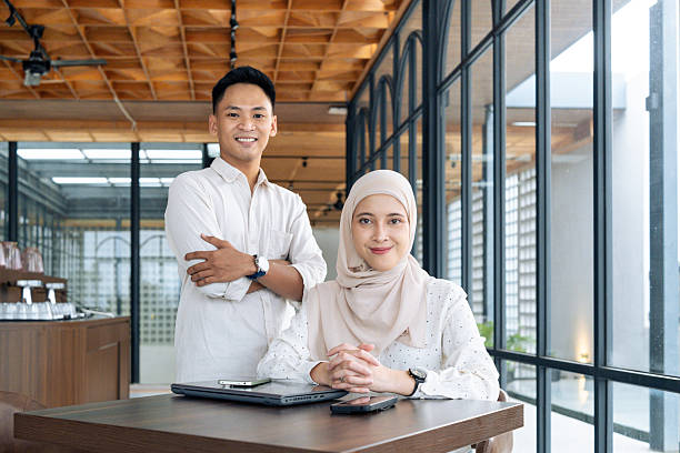 Collaborative professionals in a modern office setting, promoting teamwork and productivity. Perfect for business and workplace themes.