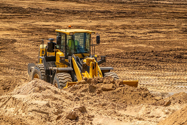 istock A crawler tractor with a bucket works in a sand quarry. 2222643402