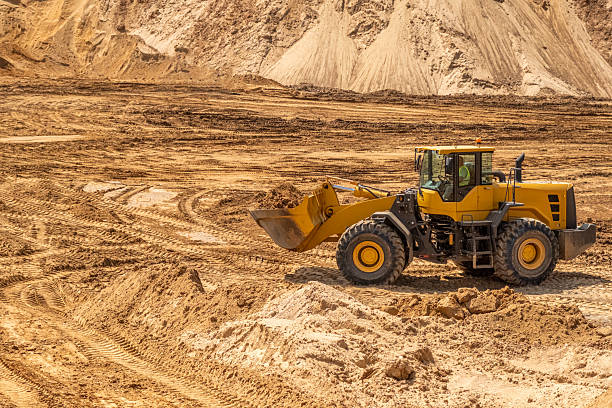 istock A crawler tractor with a bucket works in a sand quarry. 2222643510