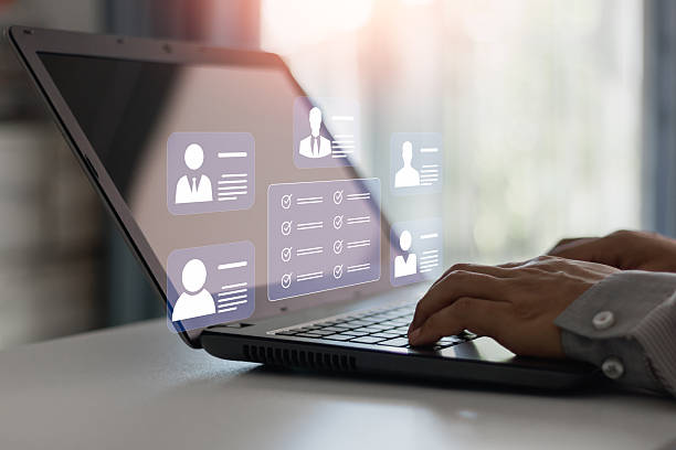 istock HR, Human resources management concept. Employees must complete the online survey form, answer test questions, and Mark the checklist on a clipboard profile view. Online business technology concept. 2222655673