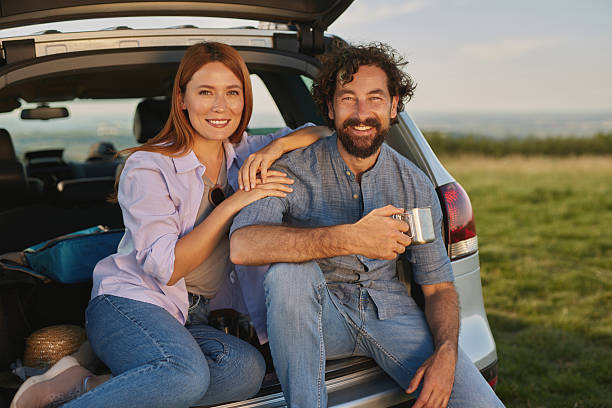 istock Couple enjoying coffee during road trip picnic 2222658609