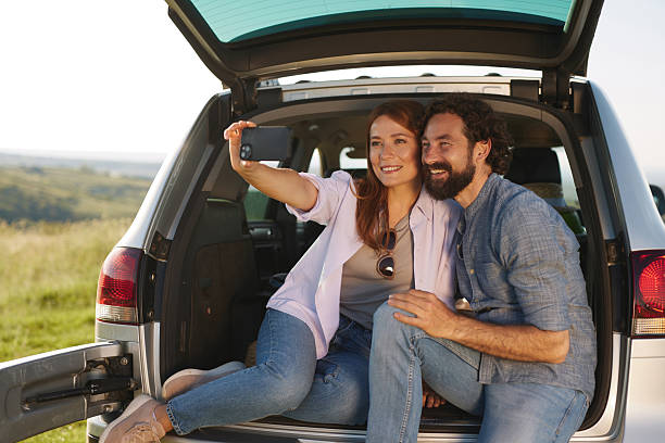 istock Couple taking a selfie during a scenic road trip picnic 2222658641