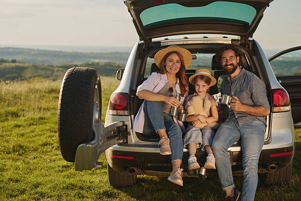 istock Family enjoying drinks during road trip picnic 2222658702