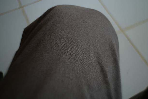istock Macro Close-Up of Textured Taupe Fabric with Subtle Light and Shadow 2222664579