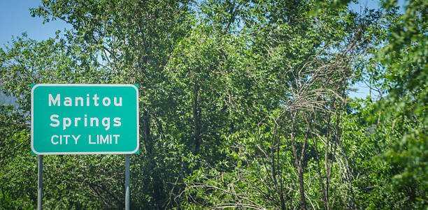 A sign leads drivers towards Manitou Springs, Colorado, USA.