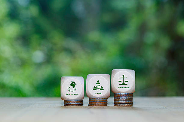 istock Net zero icon, carbon neutral and ESG concept. net zero greenhouse gas emissions target Climate neutral. Human hand holding eco green energy system icon around on blue background. 2222677047