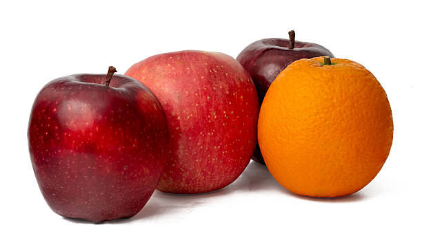 istock The High-resolution of red apple and ornage  fruit photos with a 45MP camera isolate on white 2222678558