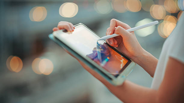 istock hands analyzing ai-powered trading chart on digital tablet with live stock data and crypto volatility tracking analytics dashboard on touchscreen showing stock index changes and ai market forecasting 2026 2222690669