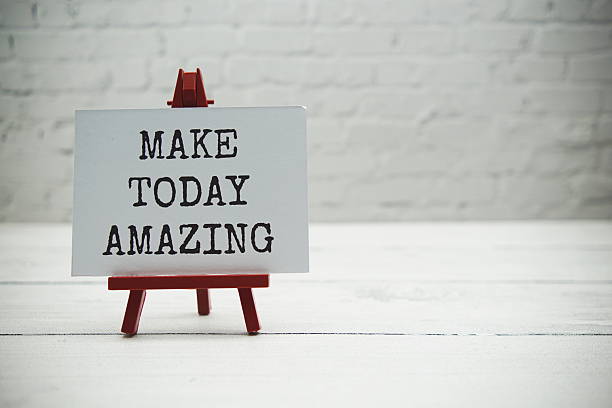 istock Make today amazing text on white brick wall and wooden background 2222691488