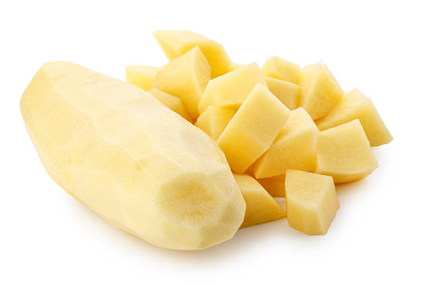 istock Whole raw potatoes and Raw potatoes, cut into pieces isolated on a white background 2222698656