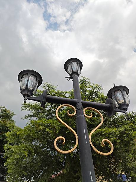 istock Low angle garden lamp with sky and leaves 2222699045