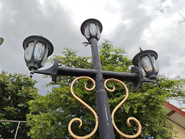 istock Low angle garden lamp with sky and leaves 2222699046
