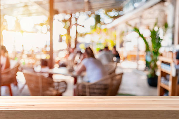 istock Blurred image of atmosphere of a beachside cafe with empty table and copy space 2222702581