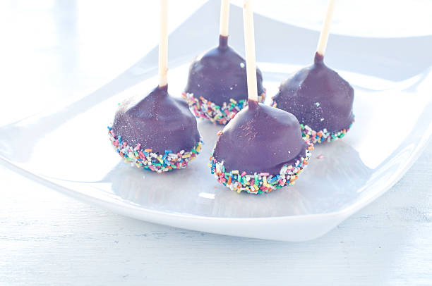 Small cupcake with chocolate in the shape of Chupa Chups decorated with sugar,italy