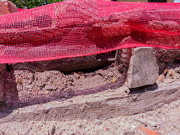 istock Detail from construction of house and red plastic net 2222709202