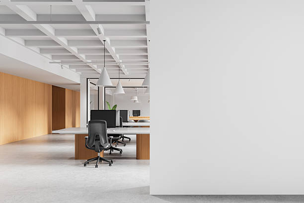 istock Modern office interior with large blank wall for poster mockup or advertising display in bright minimal workspace layout. 3D Rendering. 3D Rendering 2222711799