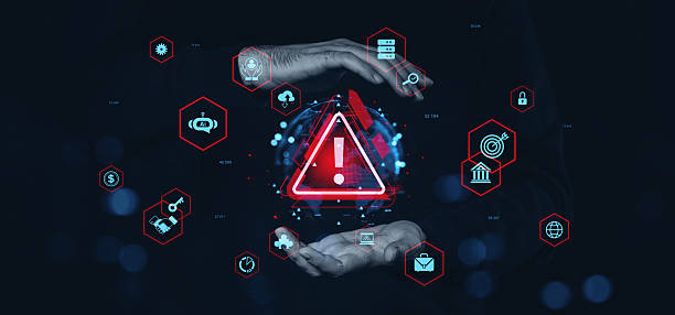 istock Cybersecurity warning alert with technology icons and human hands on dark background. 2222711906