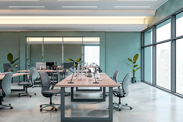 istock Modern empty office interior with minimalist design, large desks, ergonomic chairs, and panoramic city view through glass windows. 3D Rendering 2222712181