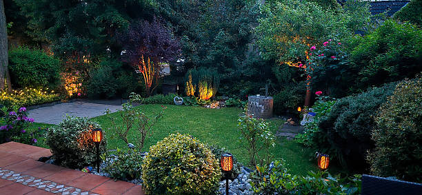 istock Beautiful home garden at sunset illuminated by lights  work with solar energy 2222712404