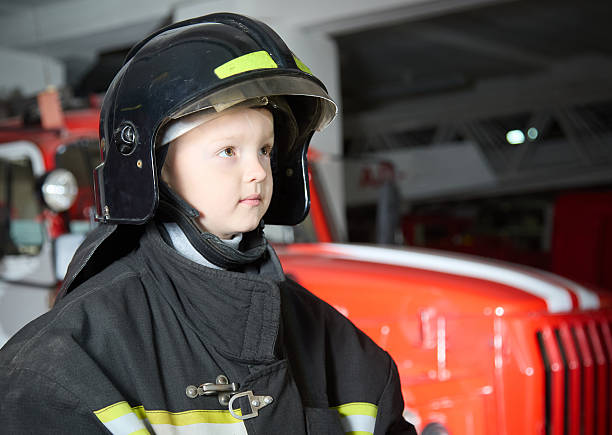 istock Brave little boy firefighter. Portrait 2222713938