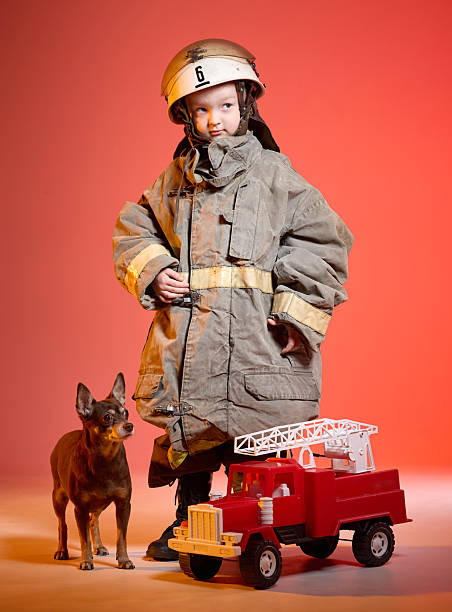 istock A brave little fireman and his faithful dog 2222714019