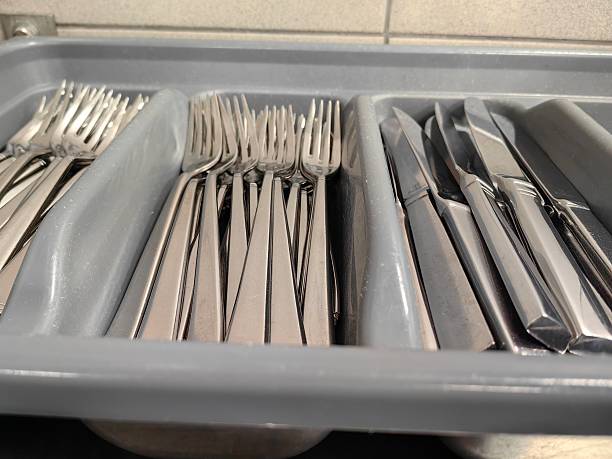 istock A container with clean cutlery ready to be set up on the restaurant table. 2222715180