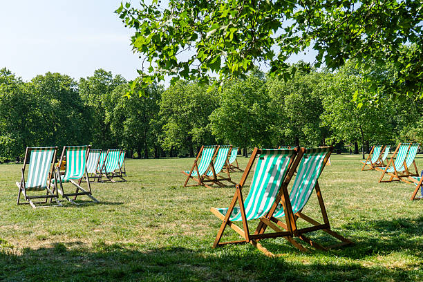 istock Green deckchairs in a London park in spring 2222717492