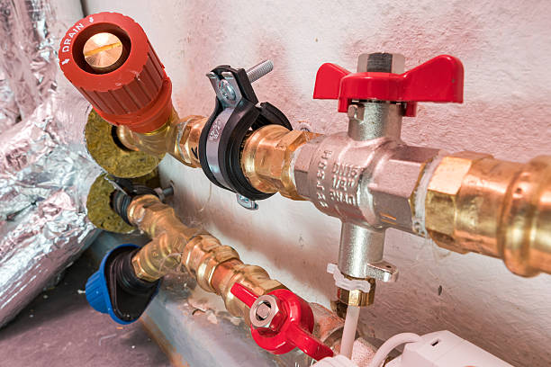 istock Insulated Heating Pipes with Color-Coded Valves and Wall Mount 2222719884