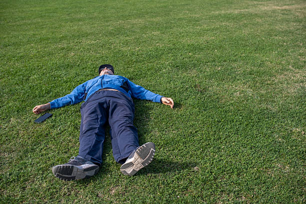 Beautiful woman relaxing on a grass