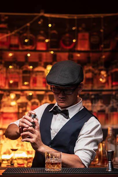 istock Bartender is pouring whiskey into a customer's glass 2222725907