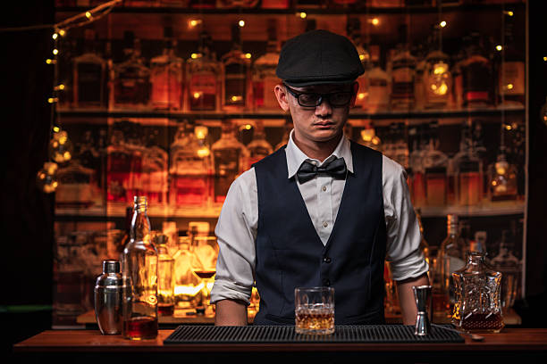 istock Bartender is pouring whiskey into a customer's glass 2222725910