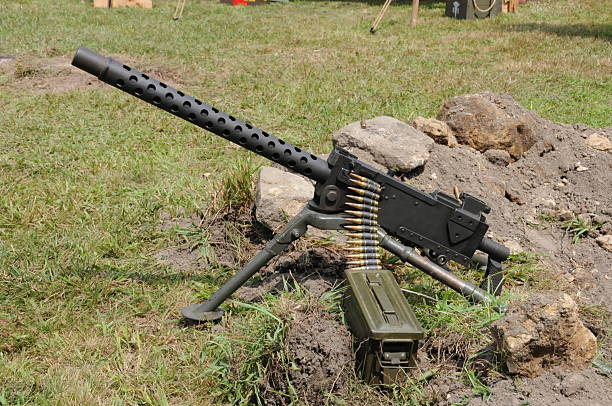 istock A World War II 30 caliber machine gun with a belt of ammunition is shown during a reenactment 2222727373