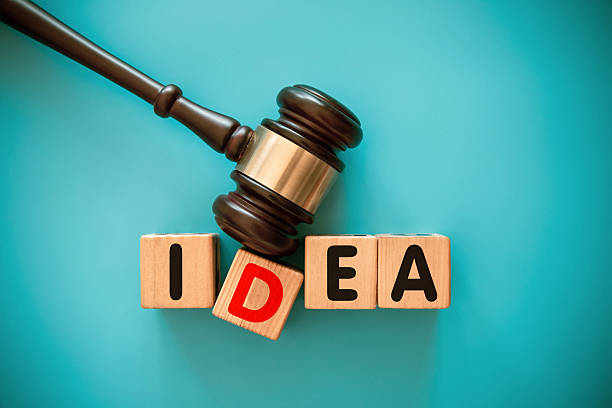 istock Gavel and toy block with IDEA 2222729750