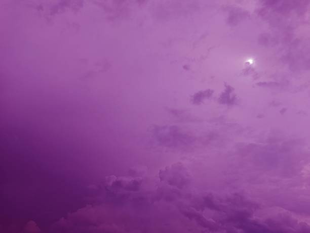 istock Dreamy Purple Sky Abstract with Clouds and Faint Sunlight 2222732922