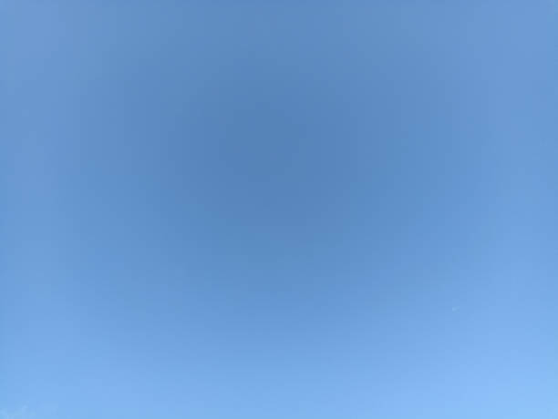 Bright sky background texture. Daytime air, bright blue sky and white clouds
