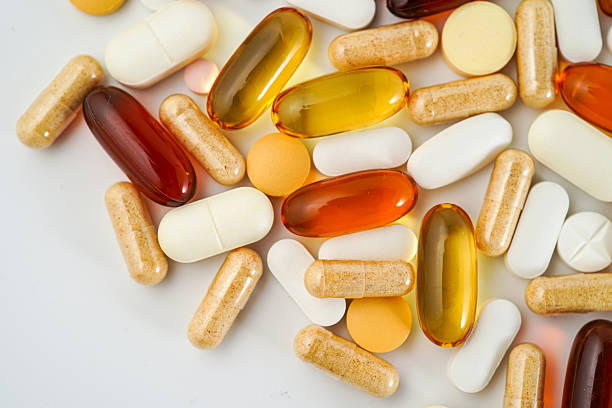 istock vitamin supplements capsules pill, softgel, fish oil, omega 3, vitamin E 2222735288