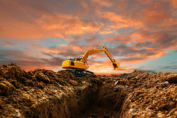 istock Excavators  are digging soil with bucket lift up . 2222736402