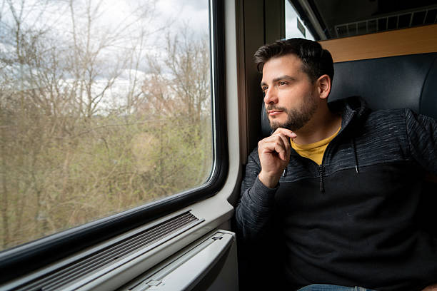 istock Young man taking a moment to relax while traveling. 2222738510
