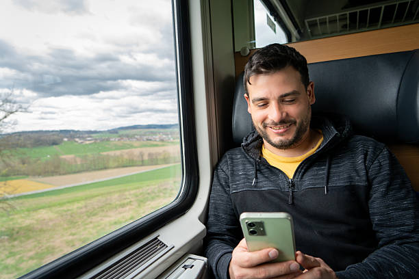 istock Young man with his cell phone checking the train arrival time. 2222738597