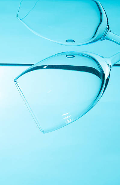 istock Glass in water  isolated on blue background. 2222742339