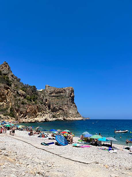 istock Tourists enjoying summer at Cala Moraig beach in Benitachell, Spain 2222743769