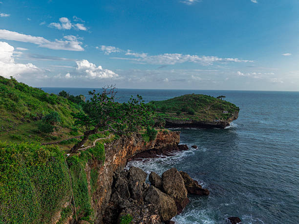 istock Dramatic Coastal Cliff and Green Island View in Indonesia 2222749717